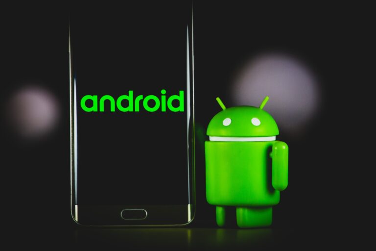 android bot beside black Samsung android smartphone