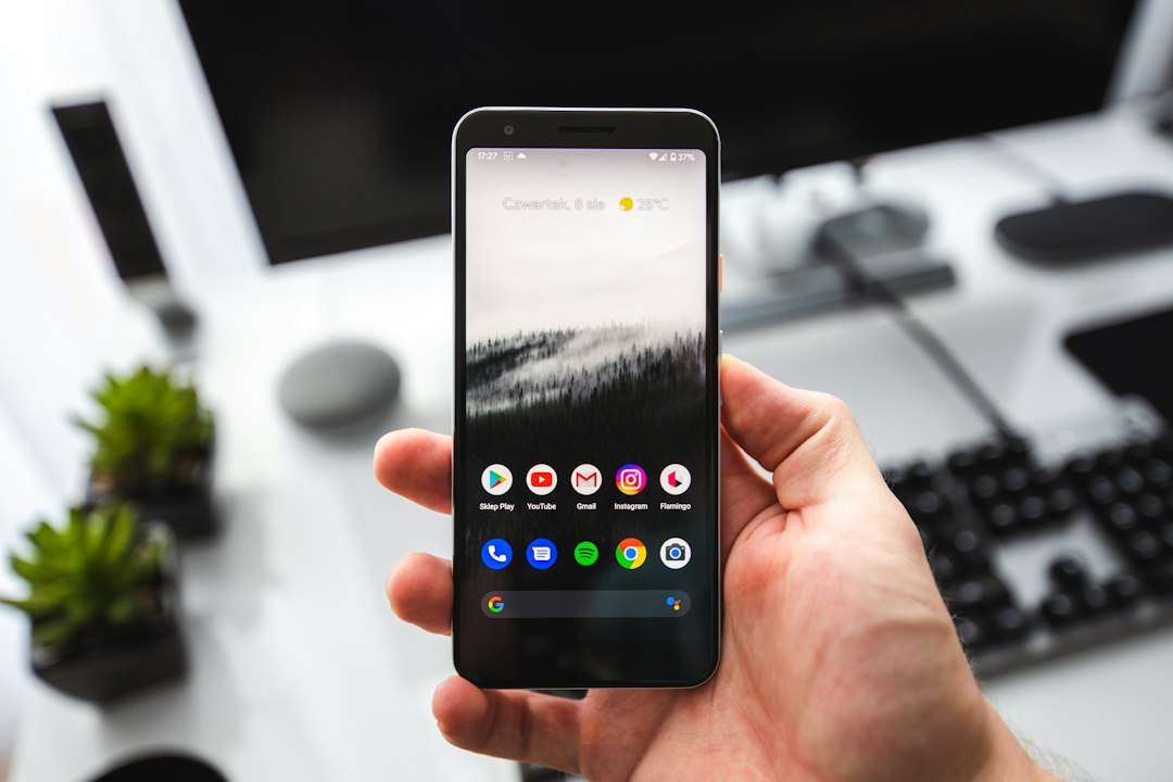 Pixel 3a by Phone Brands person holding black iphone 5