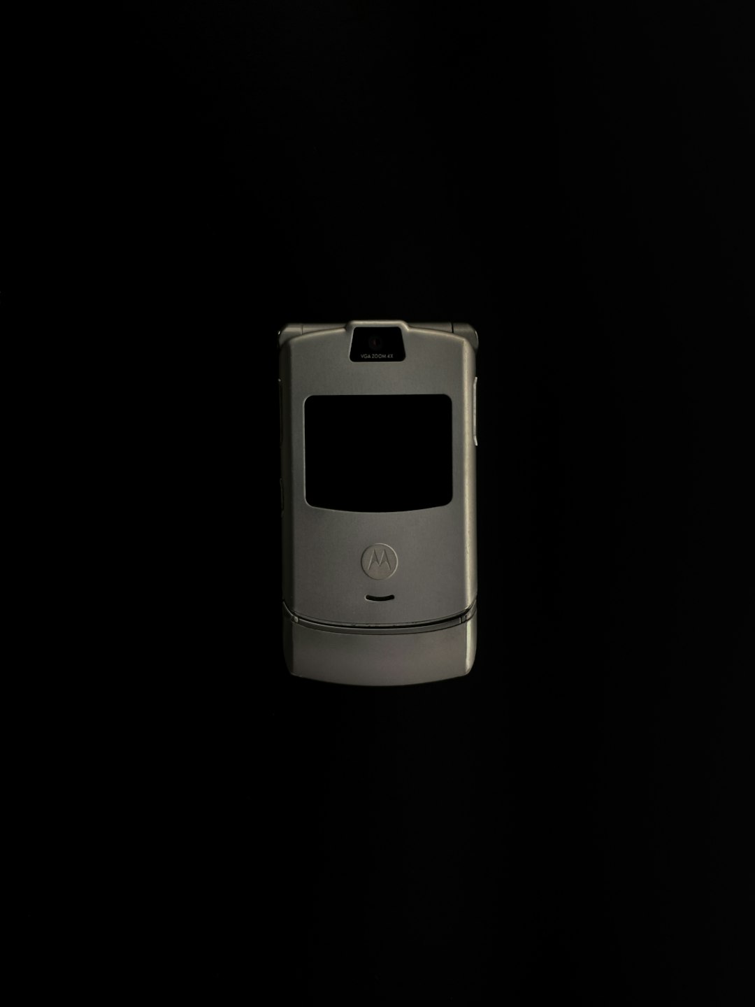 Motorola Razr on a black background by Phone Brands silver and black flip phone