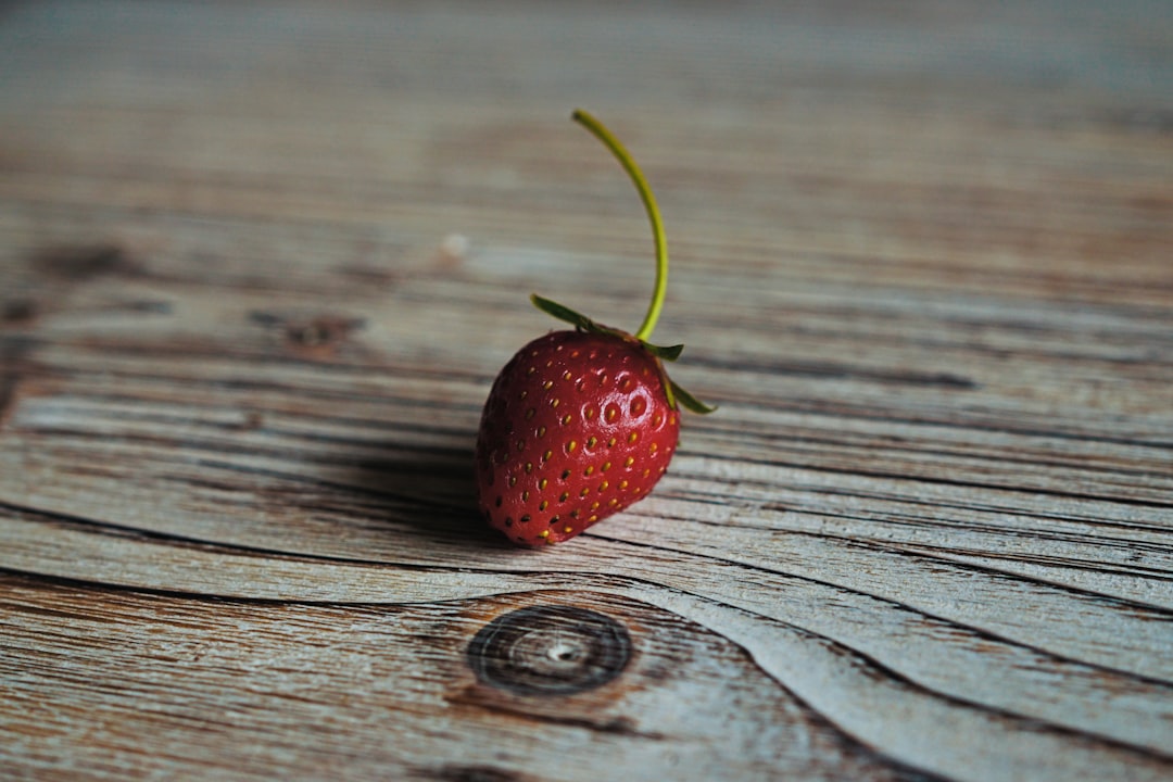 Go to your garden, plant strawberries, wait.
Wait.
Wait.
Well, wait few days, weeks, and enjoy your strawberries.
This one is the first one from my garden. by Phone Brands strawberry on wooden surface